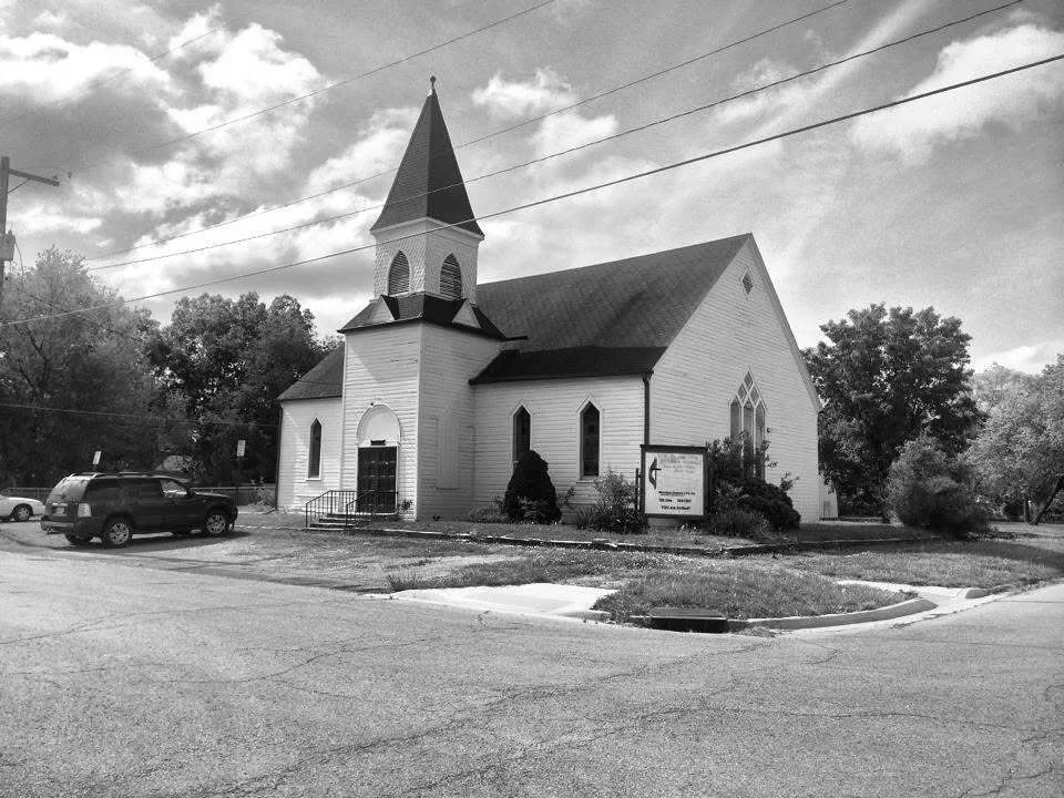 East Topeka United Methodist Church, with its wooden siding and tall steeple—the home of the first Community Thanksgiving Dinner.